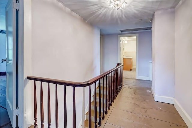 1621 Bragg St, Lima, NY 14485 - hall with baseboards and an upstairs landing