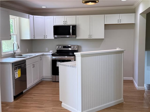 11948 River Rd, Corning, NY 14830 - kitchen with appliances with stainless steel finishes, light wood-type flooring, white cabinets, light countertops, and ornamental molding