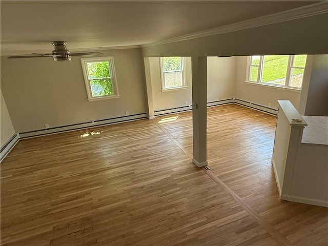11948 River Rd, Corning, NY 14830 - empty room featuring crown molding, wood finished floors, baseboard heating, and ceiling fan