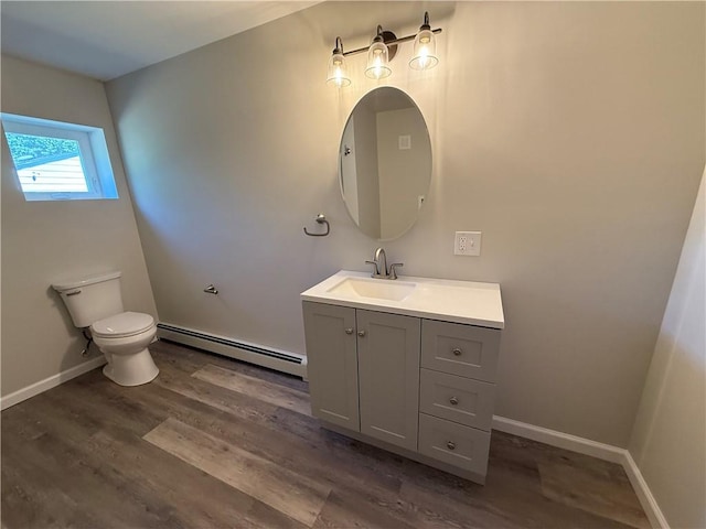 11948 River Rd, Corning, NY 14830 - bathroom with baseboard heating, vanity, and wood finished floors