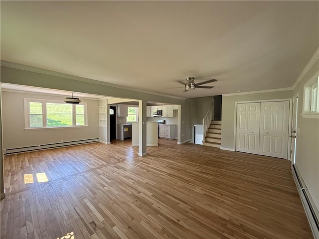 11948 River Rd, Corning, NY 14830 - unfurnished living room featuring baseboard heating, a baseboard heating unit, ornamental molding, ceiling fan, and light wood-style floors