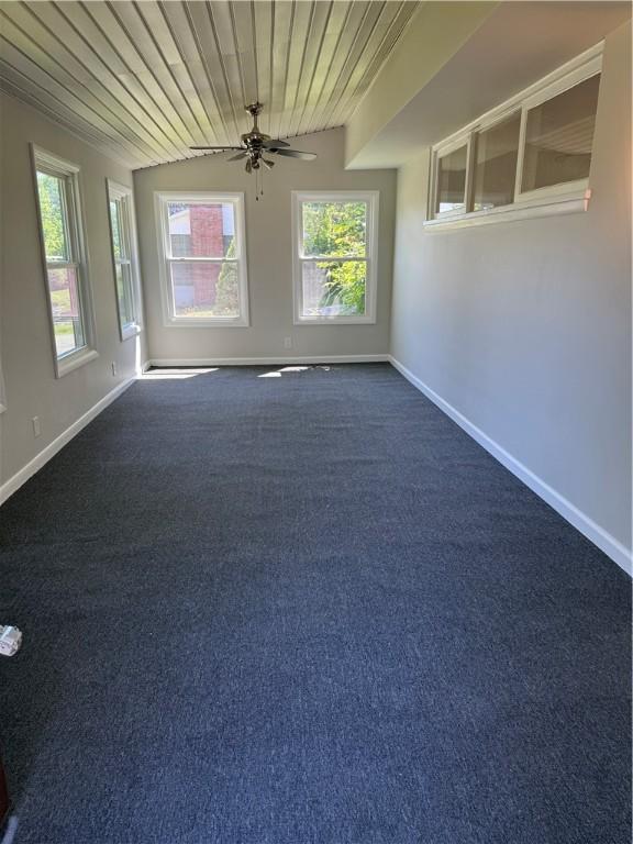 11948 River Rd, Corning, NY 14830 - unfurnished room with a ceiling fan, wooden ceiling, and dark carpet