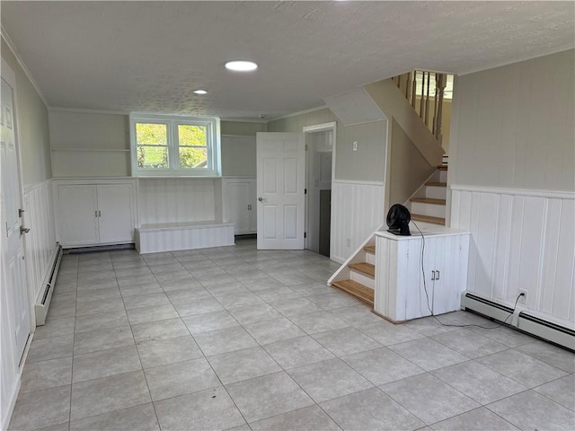 11948 River Rd, Corning, NY 14830 - empty room featuring stairs, a baseboard radiator, crown molding, light tile patterned floors, and a decorative wall