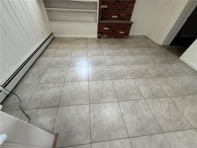 11948 River Rd, Corning, NY 14830 - spare room with baseboard heating and light tile patterned floors