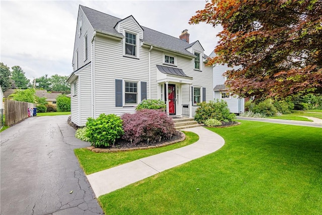 189 Hoover Rd, Irondequoit, NY 14617 - view of front of home with a chimney, roof with shingles, and driveway