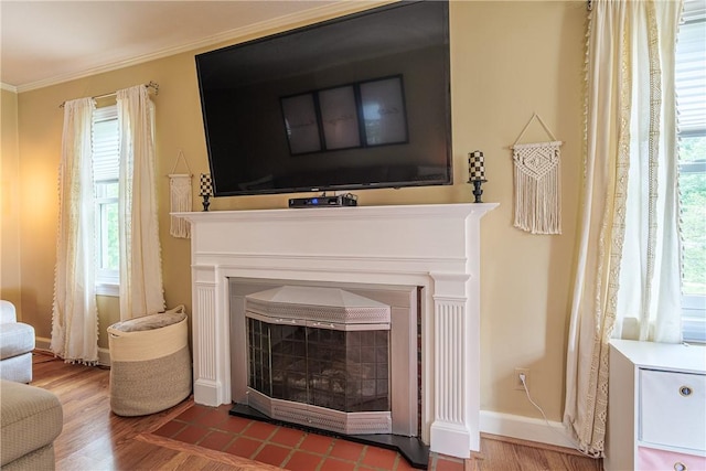189 Hoover Rd, Irondequoit, NY 14617 - detailed view of a fireplace with flush hearth, wood finished floors, and crown molding