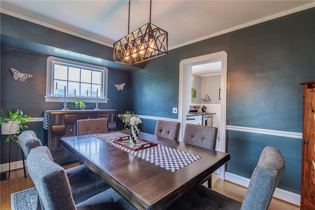 189 Hoover Rd, Irondequoit, NY 14617 - dining space with wood finished floors and ornamental molding
