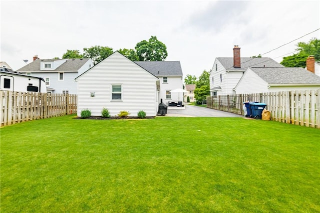 189 Hoover Rd, Irondequoit, NY 14617 - rear view of property with a fenced backyard, a residential view, and a patio area