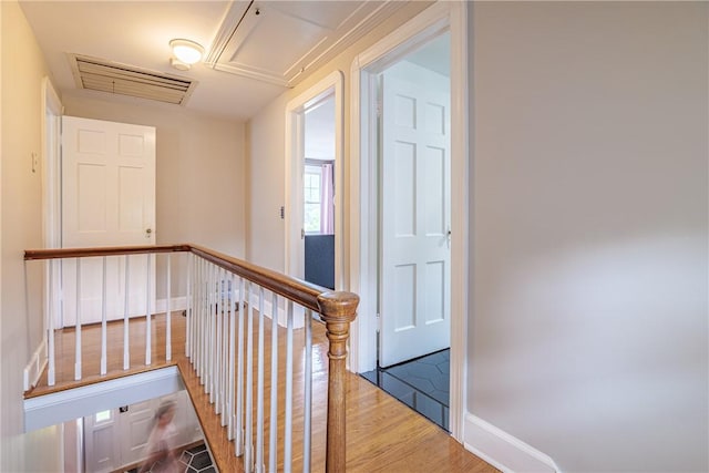 189 Hoover Rd, Irondequoit, NY 14617 - hallway featuring attic access, wood finished floors, and an upstairs landing