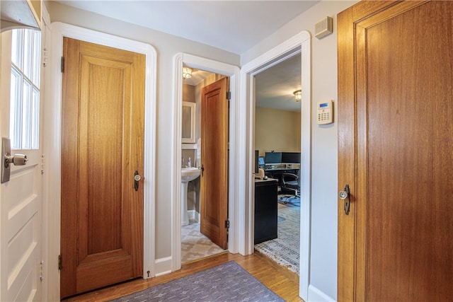 189 Hoover Rd, Irondequoit, NY 14617 - hallway featuring wood finished floors and a desk