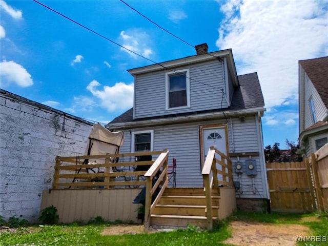 2906 Pine Ave, Niagara Falls, NY 14301 - rear view of house with a wooden deck and a chimney