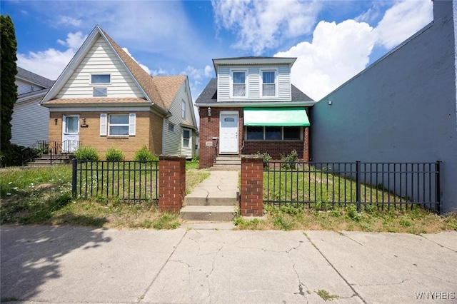 2906 Pine Ave, Niagara Falls, NY 14301 - bungalow featuring brick siding and a fenced front yard