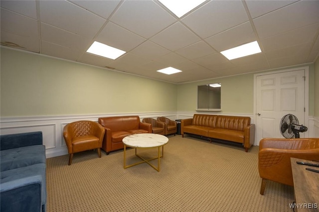 2906 Pine Ave, Niagara Falls, NY 14301 - living area featuring a wainscoted wall, a drop ceiling, light colored carpet, and a decorative wall