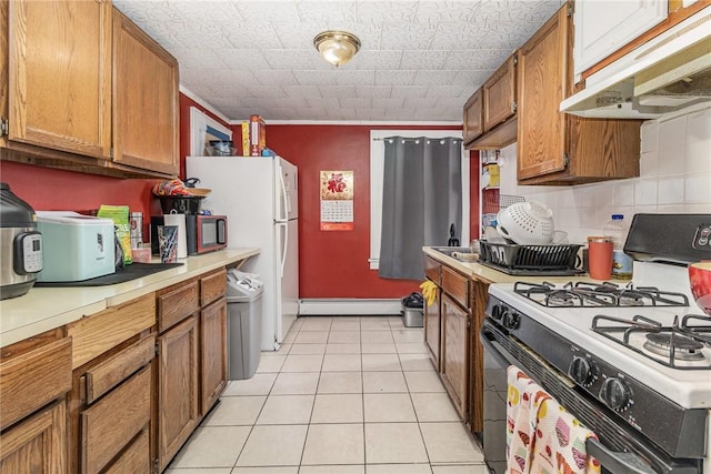 1570 Mount Hope Ave, Rochester, NY 14620 - kitchen featuring white appliances, under cabinet range hood, a baseboard radiator, light countertops, and brown cabinetry