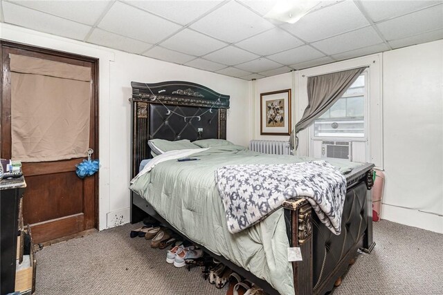 1570 Mount Hope Ave, Rochester, NY 14620 - bedroom with carpet flooring, a paneled ceiling, radiator heating unit, and cooling unit