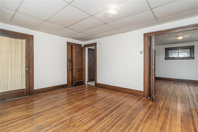 1570 Mount Hope Ave, Rochester, NY 14620 - unfurnished room featuring a paneled ceiling and hardwood / wood-style flooring