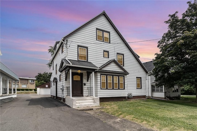 1570 Mount Hope Ave, Rochester, NY 14620 - view of front of house with an outbuilding, a lawn, and a detached garage