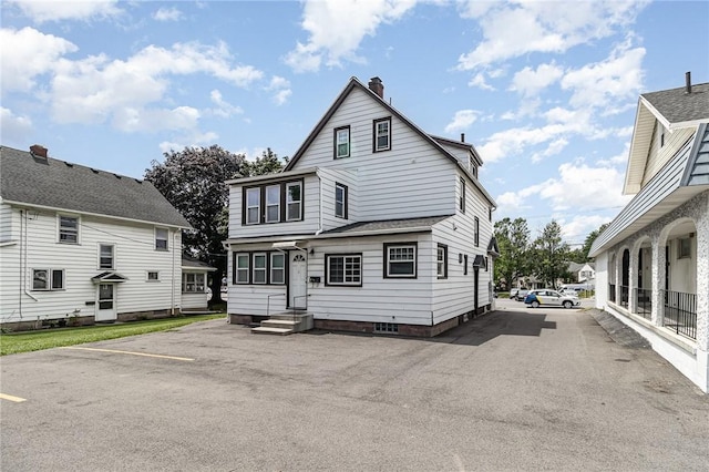 1570 Mount Hope Ave, Rochester, NY 14620 - rear view of house with a chimney and entry steps