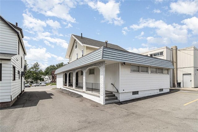 1570 Mount Hope Ave, Rochester, NY 14620 - view of property exterior with a porch and a central AC unit