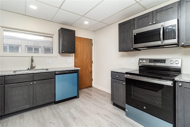 1570 Mount Hope Ave, Rochester, NY 14620 - kitchen featuring stainless steel appliances, a drop ceiling, light wood-type flooring, light stone countertops, and recessed lighting