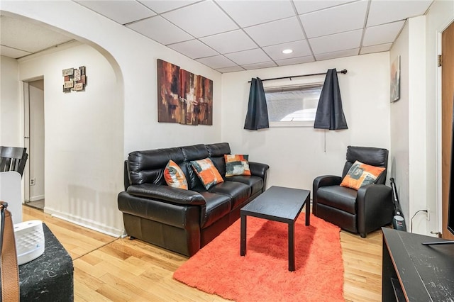 1570 Mount Hope Ave, Rochester, NY 14620 - living area featuring a drop ceiling, arched walkways, light wood-type flooring, and recessed lighting