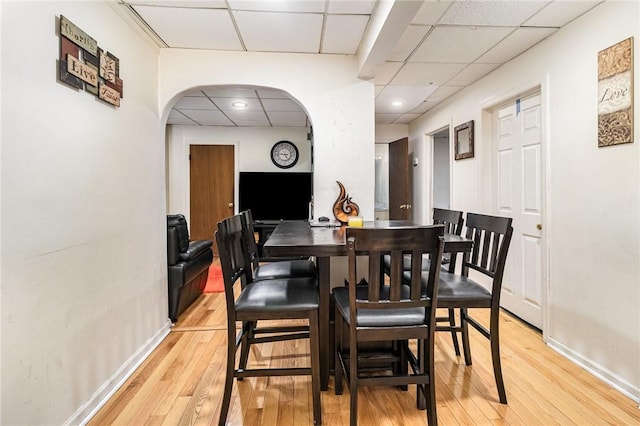 1570 Mount Hope Ave, Rochester, NY 14620 - dining area featuring a drop ceiling, light wood-type flooring, arched walkways, and recessed lighting