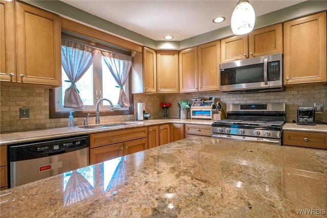 117 Colony St, Lancaster, NY 14043 - kitchen featuring stainless steel appliances, light stone countertops, decorative backsplash, and recessed lighting