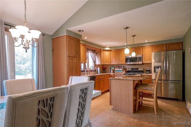 117 Colony St, Lancaster, NY 14043 - kitchen with stainless steel appliances, a chandelier, decorative backsplash, a center island, and decorative light fixtures