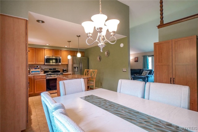 117 Colony St, Lancaster, NY 14043 - dining room featuring a chandelier, light tile patterned floors, and a towering ceiling