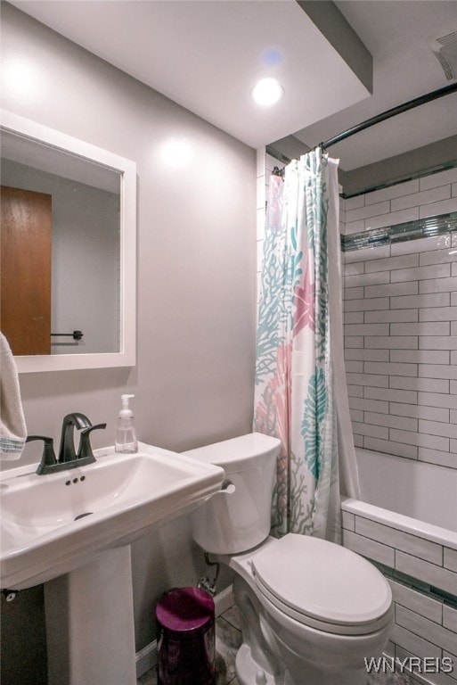117 Colony St, Lancaster, NY 14043 - bathroom featuring toilet and tiled shower / bath combo