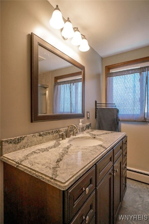 117 Colony St, Lancaster, NY 14043 - bathroom with vanity, a baseboard heating unit, and plenty of natural light