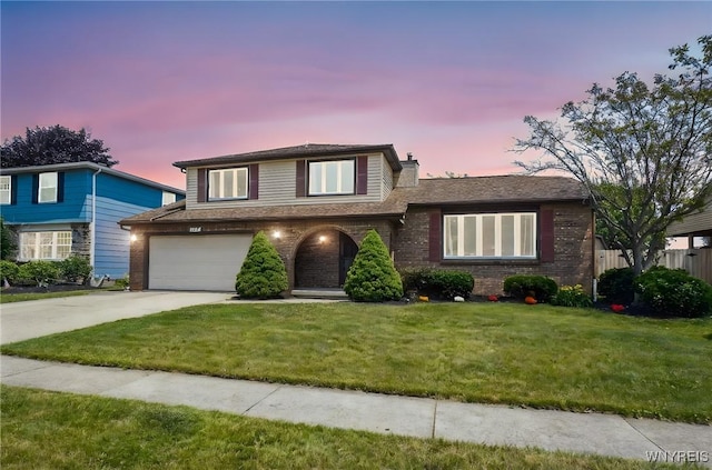 117 Colony St, Lancaster, NY 14043 - view of front of property featuring a garage, driveway, a chimney, and brick siding