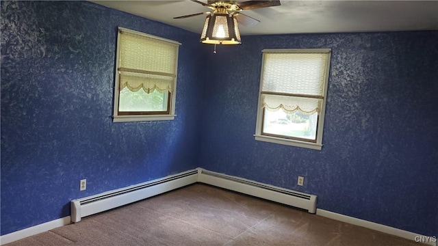 582 Peck Rd, Sullivan, NY 13082 - spare room featuring a baseboard heating unit, ceiling fan, and carpet