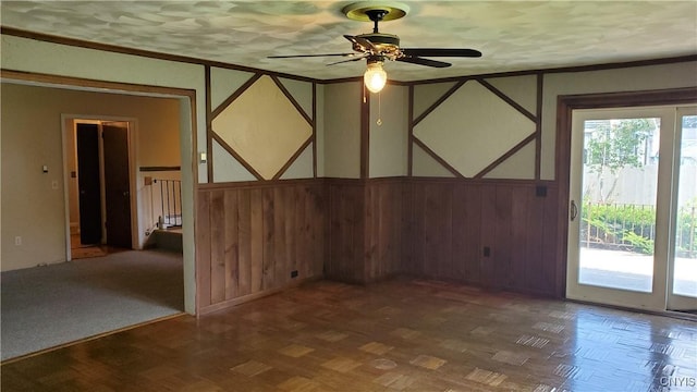 582 Peck Rd, Sullivan, NY 13082 - spare room featuring ceiling fan, ornamental molding, and a wainscoted wall