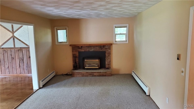 582 Peck Rd, Sullivan, NY 13082 - unfurnished living room featuring a baseboard heating unit, carpet flooring, a brick fireplace, and a textured ceiling