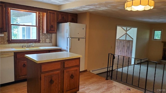 582 Peck Rd, Sullivan, NY 13082 - kitchen featuring white appliances, decorative backsplash, light wood-style floors, and light countertops