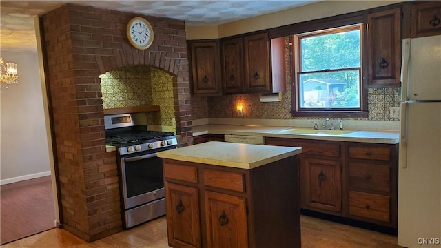 582 Peck Rd, Sullivan, NY 13082 - kitchen with white appliances, light countertops, tasteful backsplash, and light wood finished floors