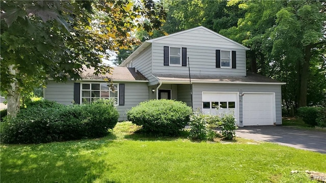 582 Peck Rd, Sullivan, NY 13082 - view of front of property with an attached garage, driveway, a front yard, and roof with shingles