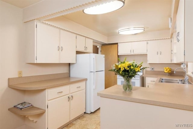 356 Union Rd, West Seneca, NY 14224 - kitchen featuring freestanding refrigerator, light countertops, a peninsula, and open shelves