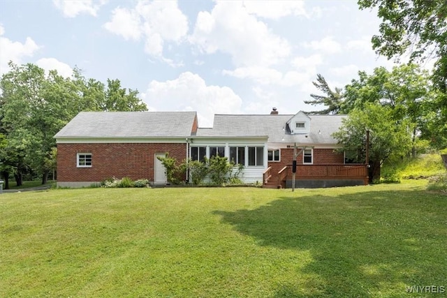 356 Union Rd, West Seneca, NY 14224 - rear view of house with brick siding and a yard