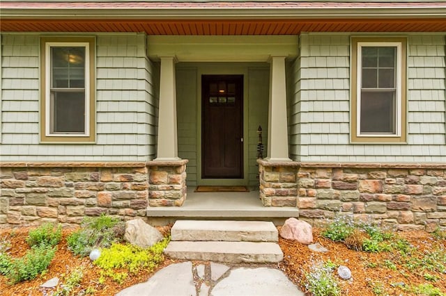 1537 Cranberry Pond, Victor, NY 14564 - doorway to property with stone siding and a porch