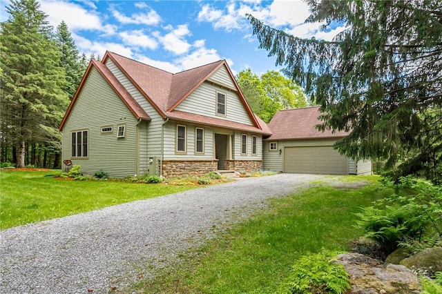 1537 Cranberry Pond, Victor, NY 14564 - view of front facade featuring gravel driveway, stone siding, a garage, an outdoor structure, and a front lawn