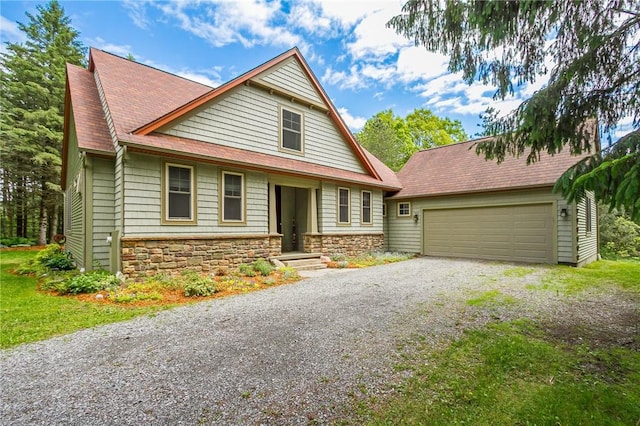 1537 Cranberry Pond, Victor, NY 14564 - view of front of property featuring stone siding, driveway, a shingled roof, and an attached garage