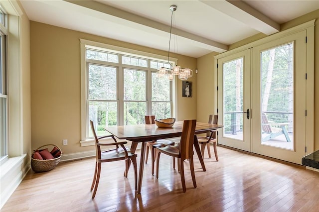 1537 Cranberry Pond, Victor, NY 14564 - dining space featuring healthy amount of natural light, light wood finished floors, a chandelier, french doors, and beamed ceiling