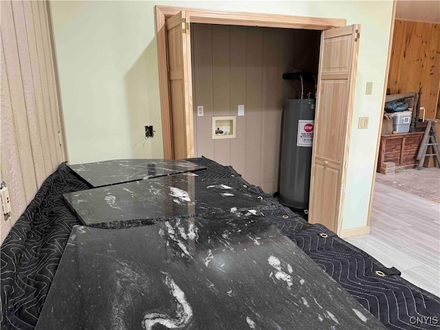 108 Linlyco Lake Rd, New Albion, NY 14719 - washroom featuring washer hookup, water heater, and wood walls