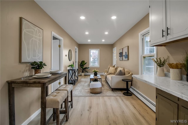 201 Ohio St, Ridgeway, NY 14103 - living room featuring a baseboard heating unit, light wood-type flooring, and recessed lighting