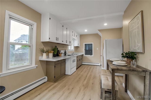 201 Ohio St, Ridgeway, NY 14103 - kitchen featuring a baseboard radiator, baseboard heating, light countertops, light wood-type flooring, and white cabinets
