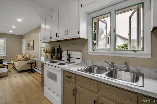 201 Ohio St, Ridgeway, NY 14103 - kitchen featuring white range with electric stovetop, light countertops, plenty of natural light, light wood-style floors, and recessed lighting