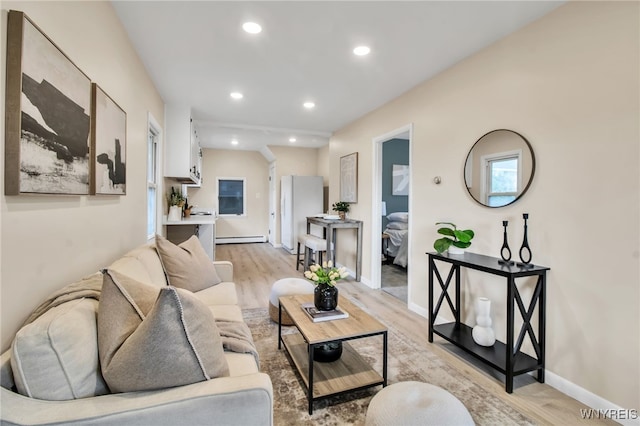 201 Ohio St, Ridgeway, NY 14103 - living room with light wood-type flooring, a baseboard radiator, and recessed lighting