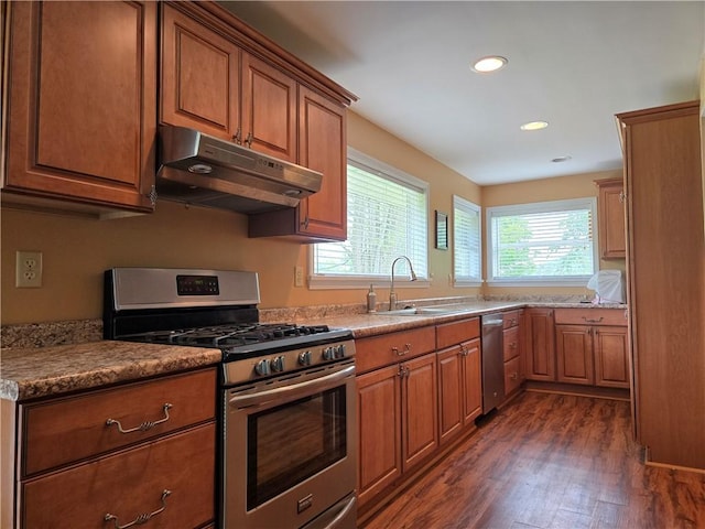 4197 County Highway 26, Colchester, NY 13782 - kitchen with stainless steel appliances, under cabinet range hood, dark wood-style flooring, brown cabinetry, and recessed lighting